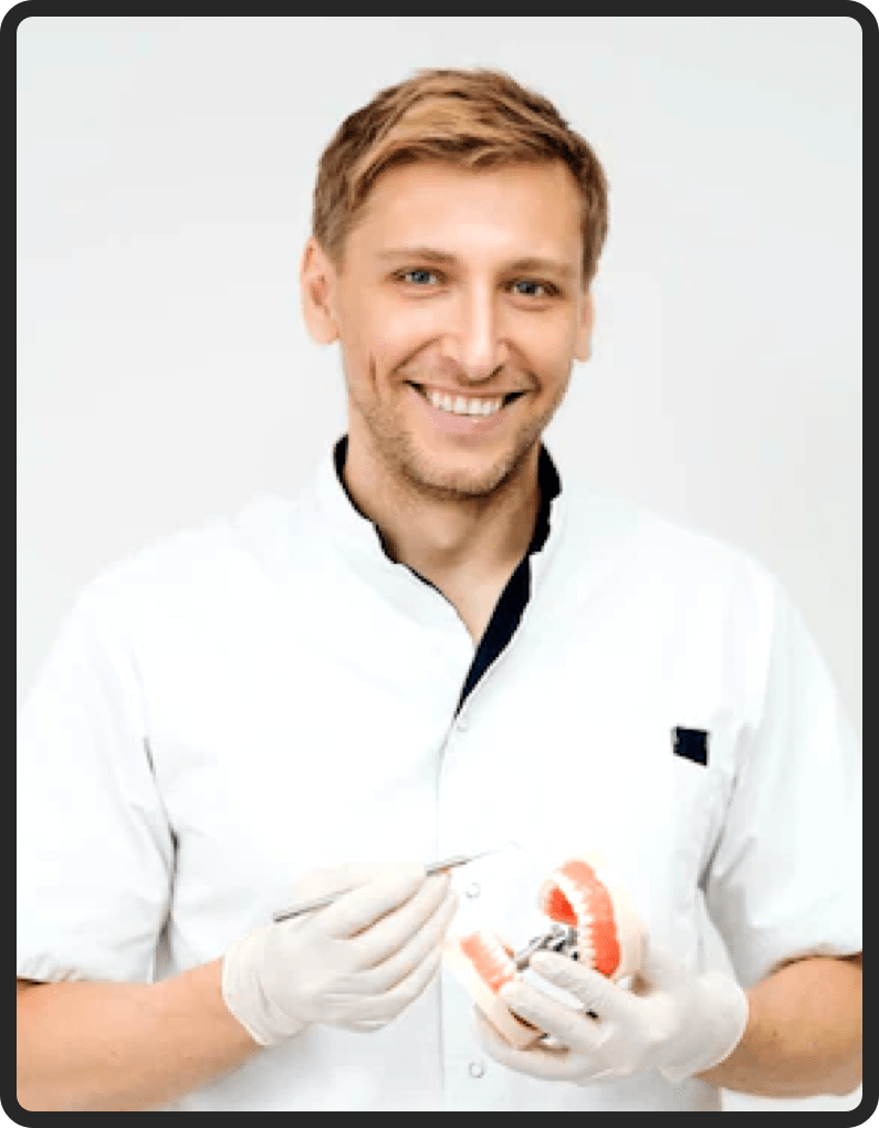 Dentist holding a dental model